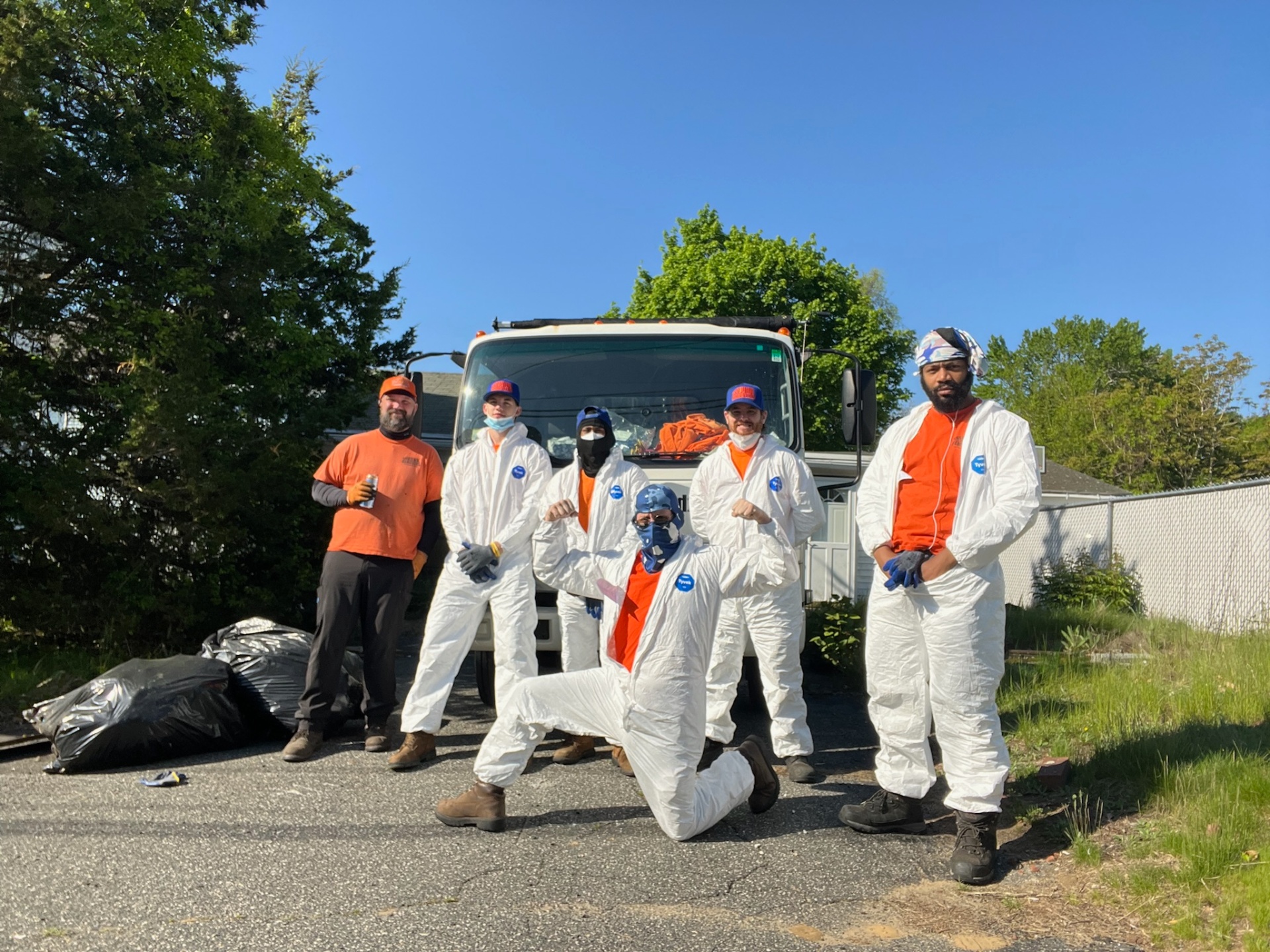 Full Junk Removers crew suited up for a property cleanout